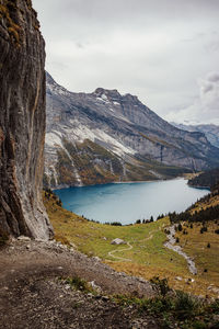Scenic view of lake and mountains against sky