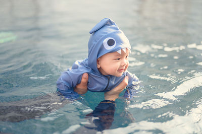 Cute boy in swimming pool