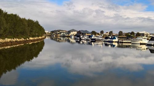 Panoramic view of lake and buildings against sky