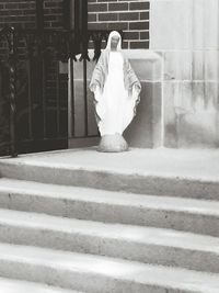 Full length of woman standing on railing