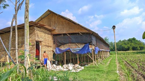 Built structure on field against sky