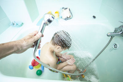 Mother and daughter in bathtub