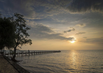 Scenic view of sea against sky at sunset