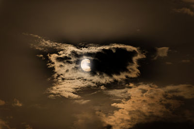 Low angle view of moon at sunset