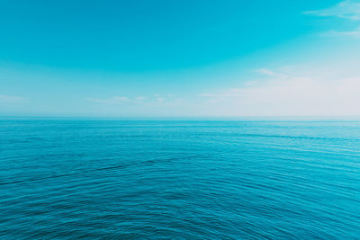 Scenic view of sea against blue sky