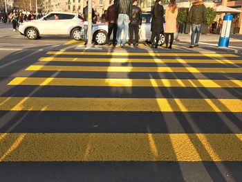 Low section of people on zebra crossing