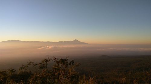 Scenic view of mountains against sky during sunset