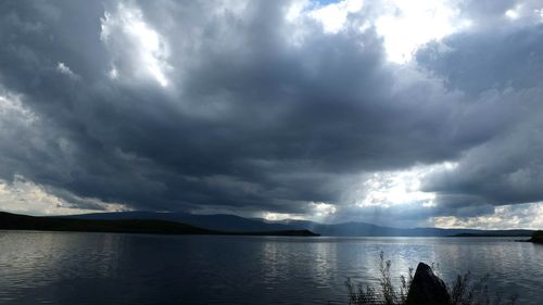 Panoramic view of sea against cloudy sky