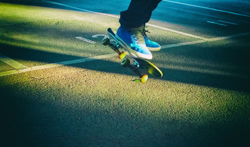 Low section of person with shadow on floor