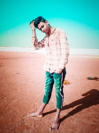 Full length of man standing on beach