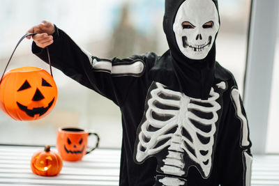 Midsection of woman wearing mask