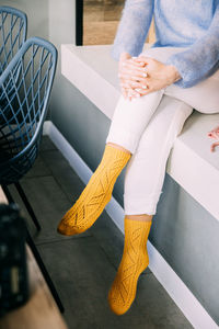 Low section of woman standing on floor