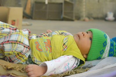 Boy sleeping on bed