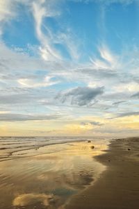 Scenic view of beach against sky during sunset