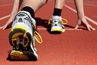 Low section of athlete on running track