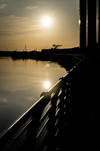 Scenic view of river against sky during sunset