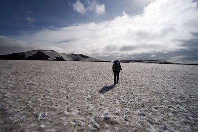 Full length of man walking on sand