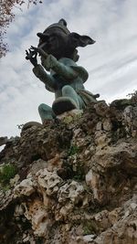 Low angle view of sculpture against sky