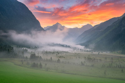 Scenic view of mountains against sky during sunset