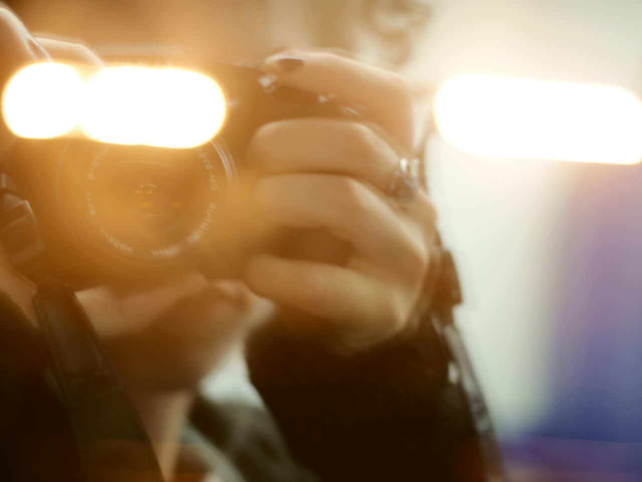 CLOSE-UP OF HAND HOLDING BURNING