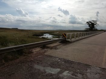 Bridge over road against sky