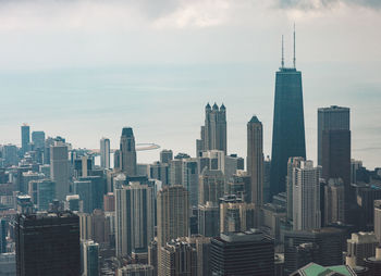 Modern buildings in city against sky