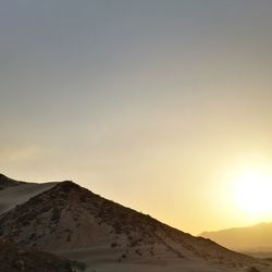 Scenic view of mountains against sky during sunset