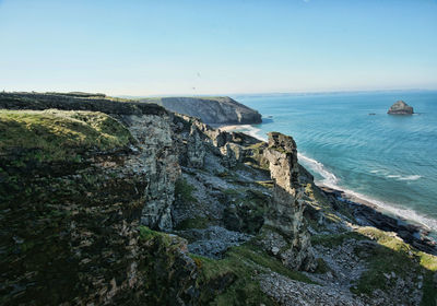 Scenic view of sea against clear blue sky