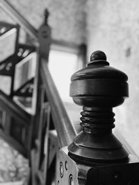 Close-up of old metal railing against wall