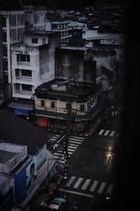 High angle view of city street and buildings at night