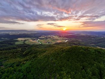 Aerial view of landscape against sky during sunset