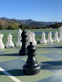 Full frame shot of chess board against mountain range