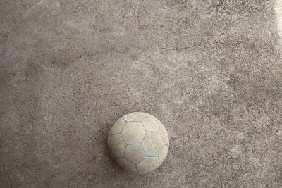 High angle view of soccer ball on land