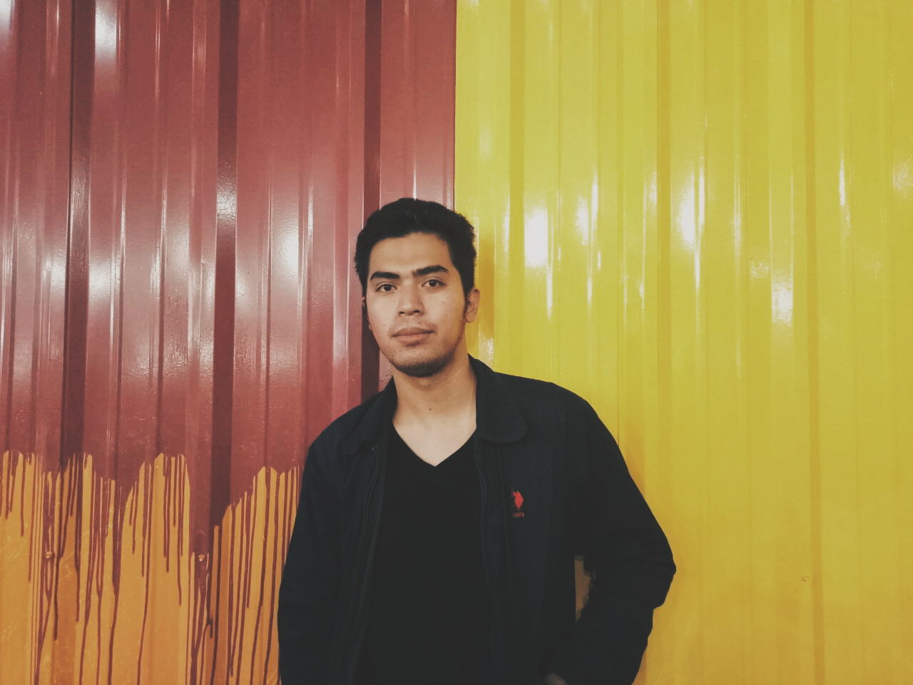 curtain, front view, young adult, standing, portrait, young men, looking at camera, one person, indoors, real people, illuminated, corrugated iron, one man only, only men, day, people, adult