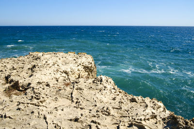 Scenic view of sea against clear blue sky