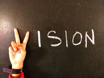 Close-up of text on hand