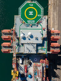 High angle view of information sign by sea