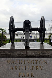 Close-up of coin-operated binoculars against sky