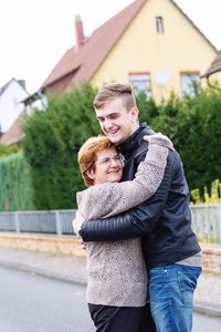 Grandmother embracing grandson