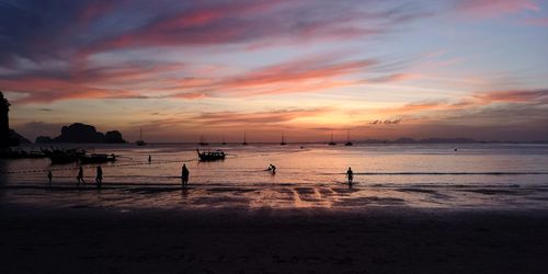 Scenic view of beach against sky during sunset