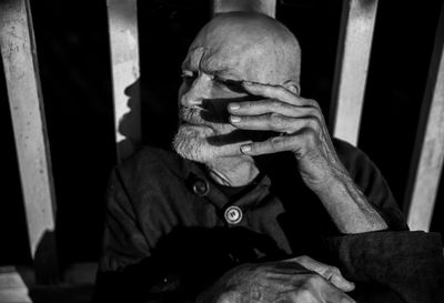 Portrait of a man sitting on floor