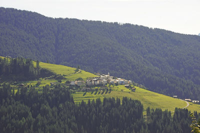 Scenic view of field and mountains against sky
