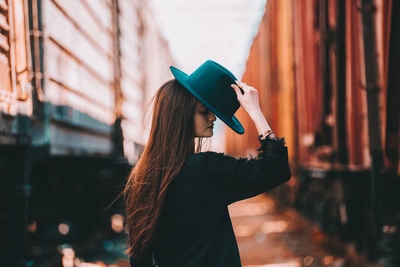 Woman standing on mobile phone