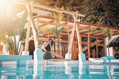 Woman sitting in swimming pool in guatemala