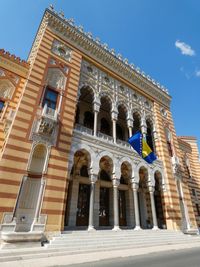 Low angle view of historical building against blue sky