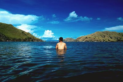 Scenic view of mountains against cloudy sky