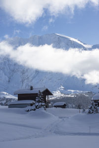 Scenic view of snowcapped mountains against sky