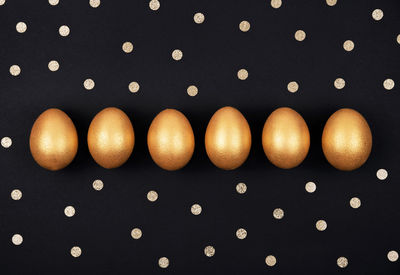 Close-up of eggs against black background