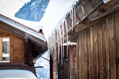 Low angle view of snow covered mountain against sky