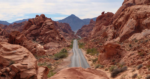 Rear view of man walking on mountain